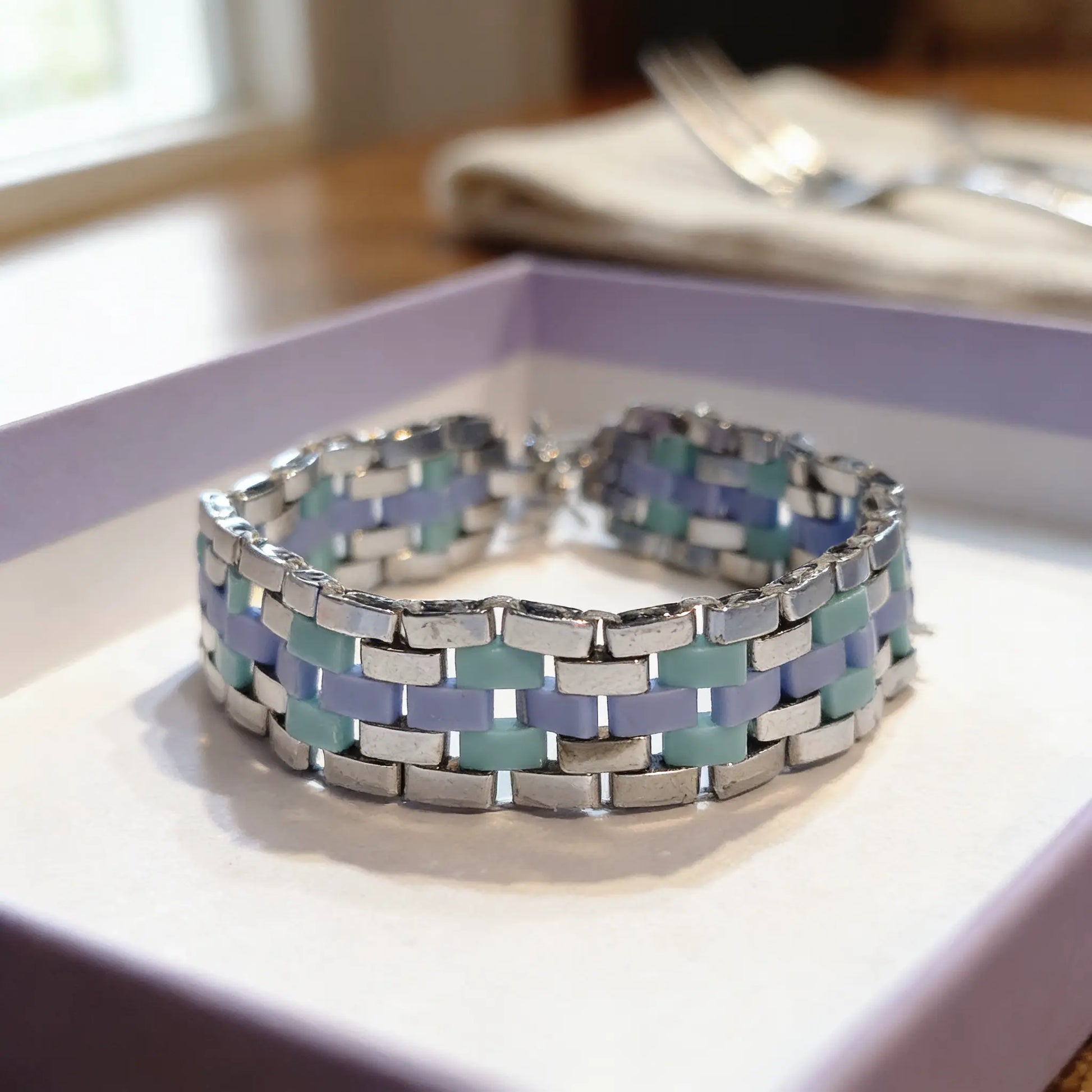 Handmade Azure Flow bracelet by Gem N Glow featuring Miyuki Tila beads in a stylish, intricate design.